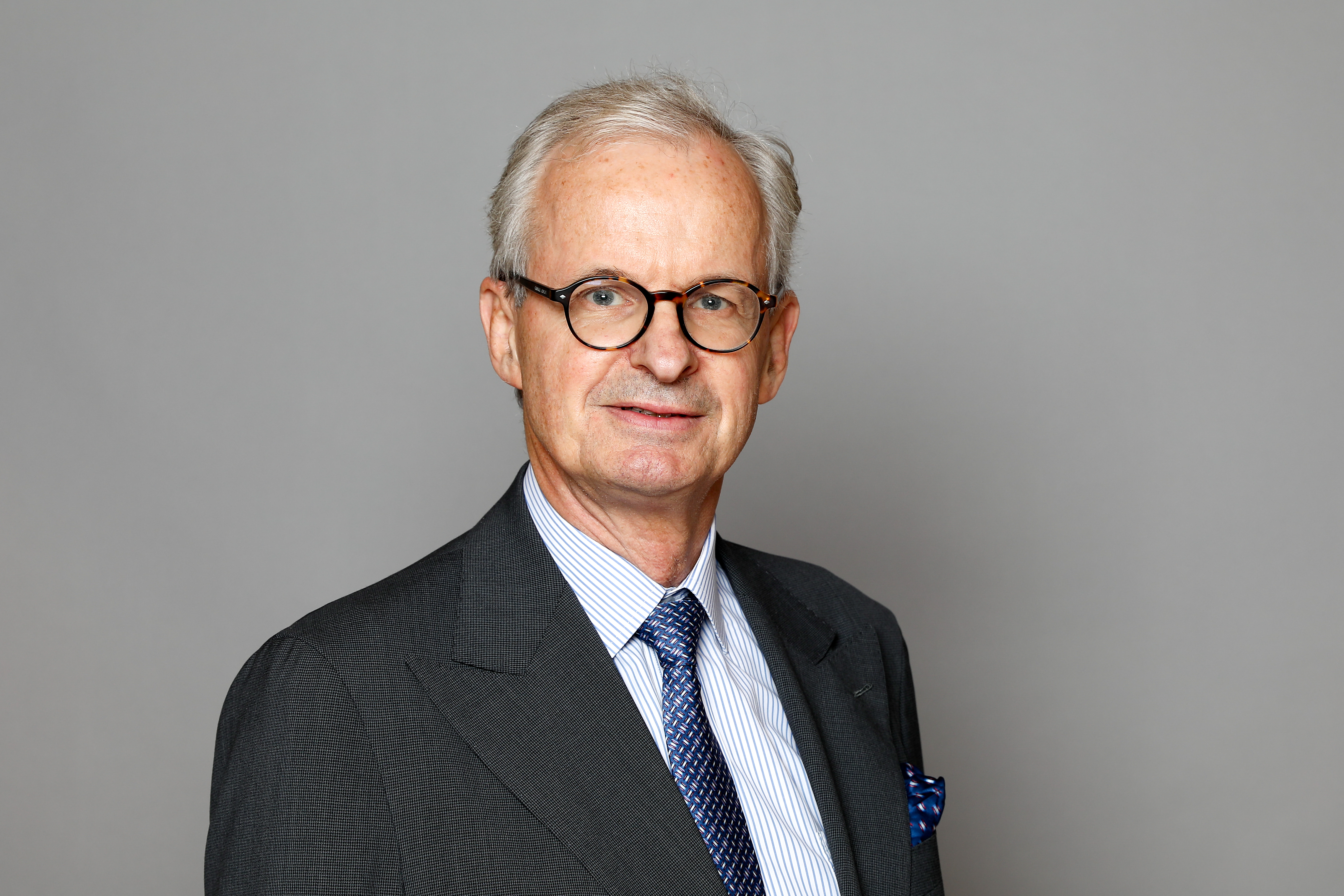 Half-length portrait of Christian Danielsson against a grey background.