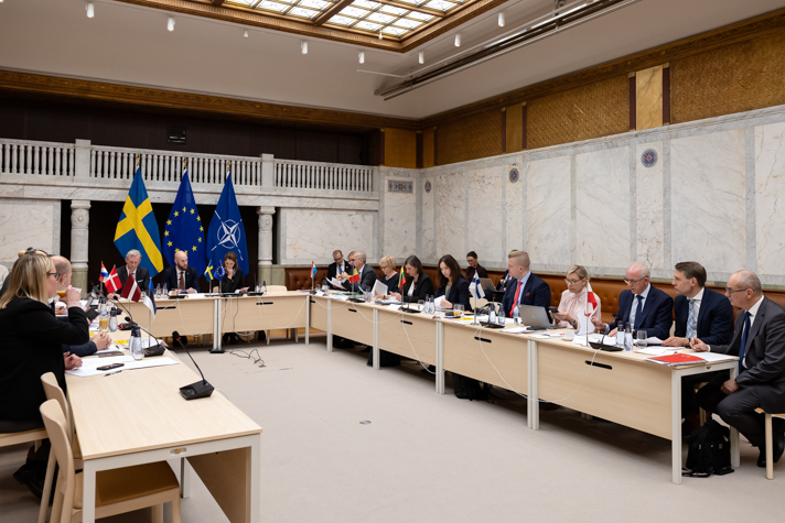 Meeting participants around a table.