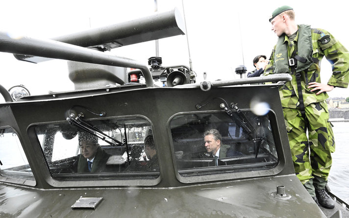 The two ministers sitting inside of the vessel.