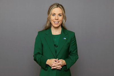 Half-length portrait of Jessica Rosencrantz against a grey background.
